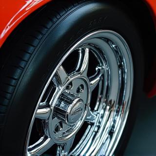 A final check on a perfectly clean car wheel.